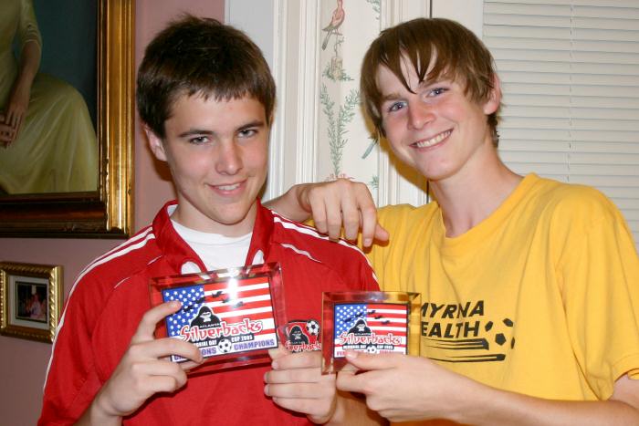 Cousins with their trophies